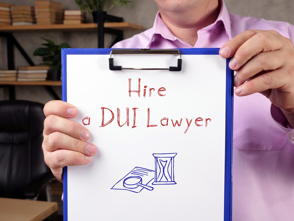 Hire a DUI Lawyer with inscription on the sheet.