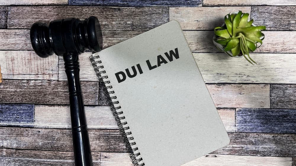  DUI LAW write on book isolated on Wooden Table.
