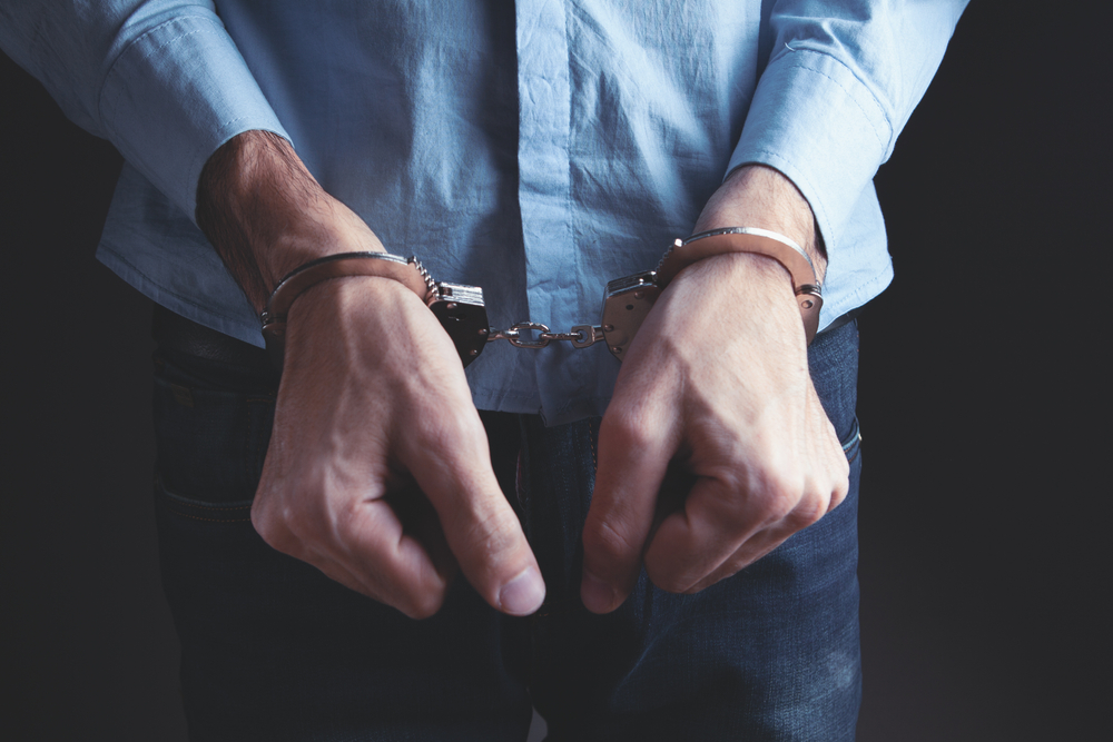 "Close-up of a man in handcuffs symbolizing being accused of a sex crime in Georgia"